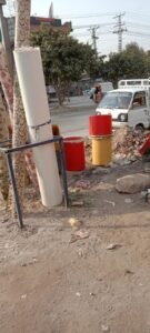 Coloured cylindrical fiberglass baskets shown outdoors
