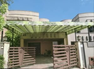 Translucent fiberglass shade canopy installed over a residential driveway