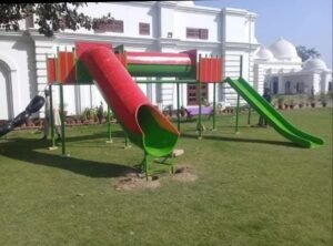 Colourful children’s park play station with tube slide and open slide