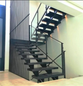 Black open-tread steel staircase with glass balustrade and vertical bars