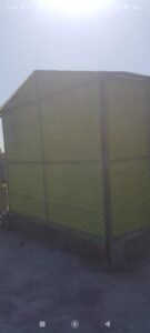 Green patterned fiberglass room or cabin exterior