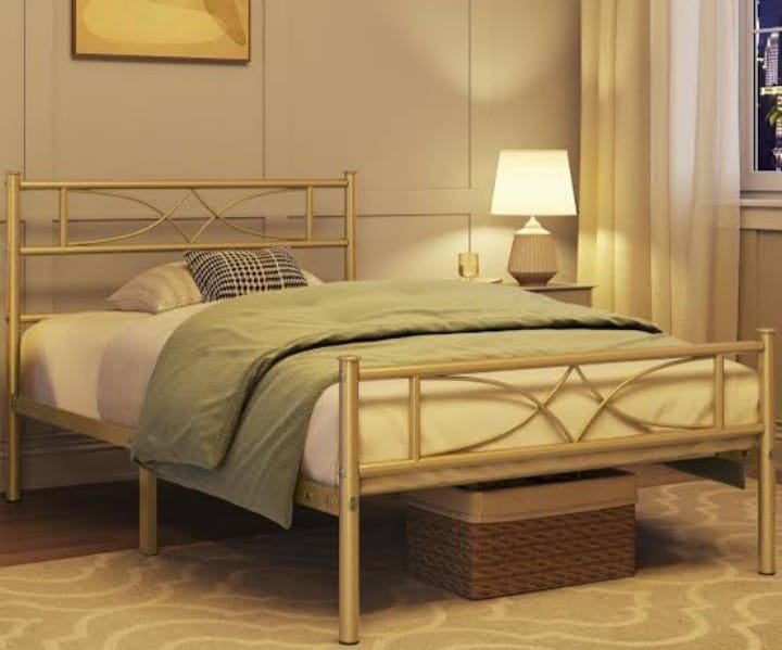 Sample design: gold-finish metal pipe bed with a decorative headboard and footboard